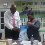 Token of Appreciation being presented to outgoing President Bro. Kelvin Pompey by Sis. Shanette Parris – Admin. Officer, SVG Co-operative League Ltd.