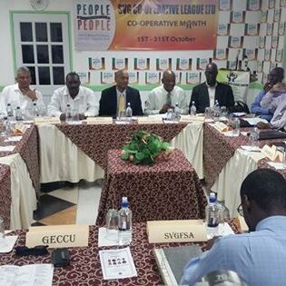 Section of the audience showing CCCU Borad of Directors along with SVG Co-op. League President at the Headtable
