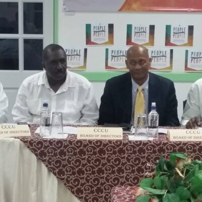 Section of the audience showing CCCU Board of Directors along with SVG Co-op. League President at the Headtable.