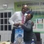Admin. Officer Sis. Shanette Parris presents Token of Appreciation to outgoing President -Bro. Kelvin Pompey.